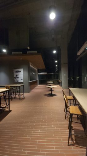 a glass wall with people in it