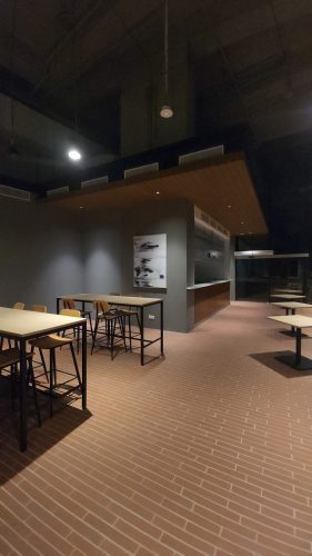 a glass wall with people in it